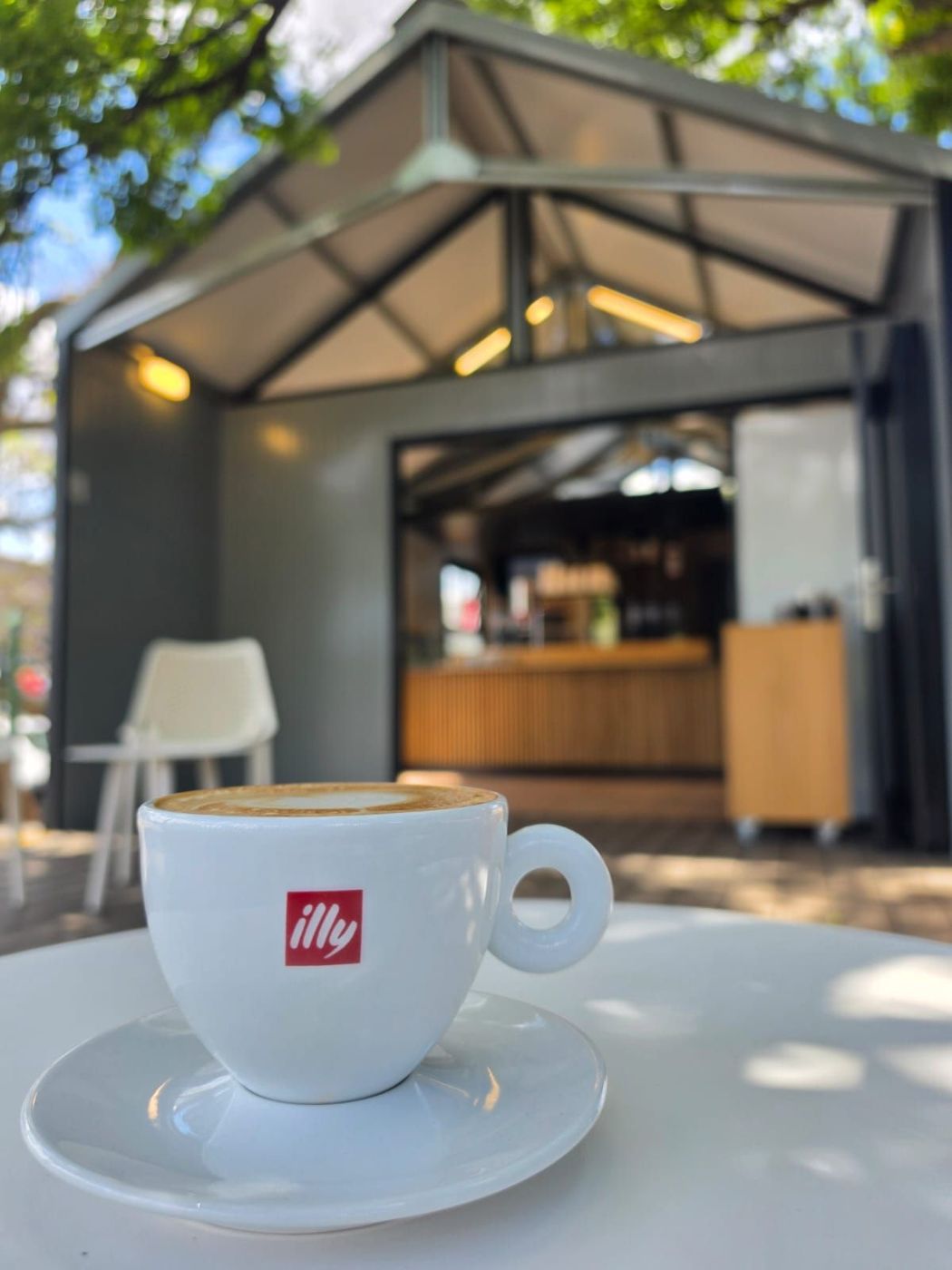 Cappuccino on a table outside the open Tiny Town Café unit
